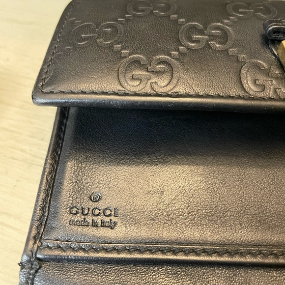 Gucci black leather Guccisimo trifold wallet with blk leather & gold tipped bow - Picture 10 of 15
